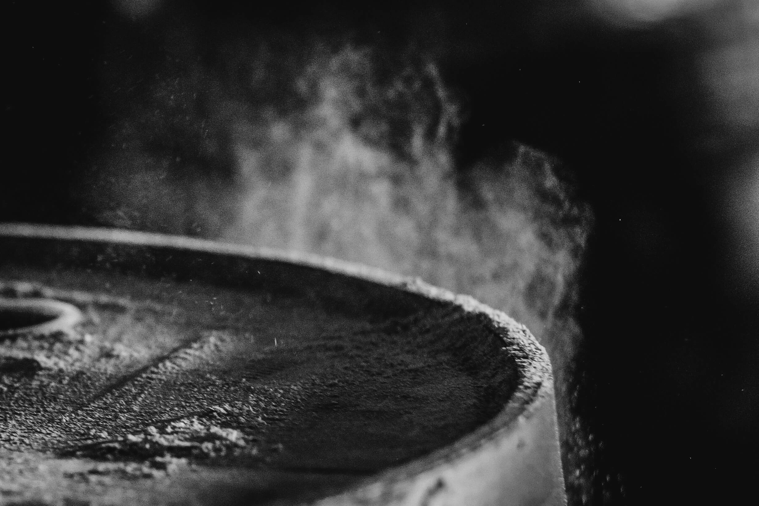 Sawdust surrounding a wooden cask