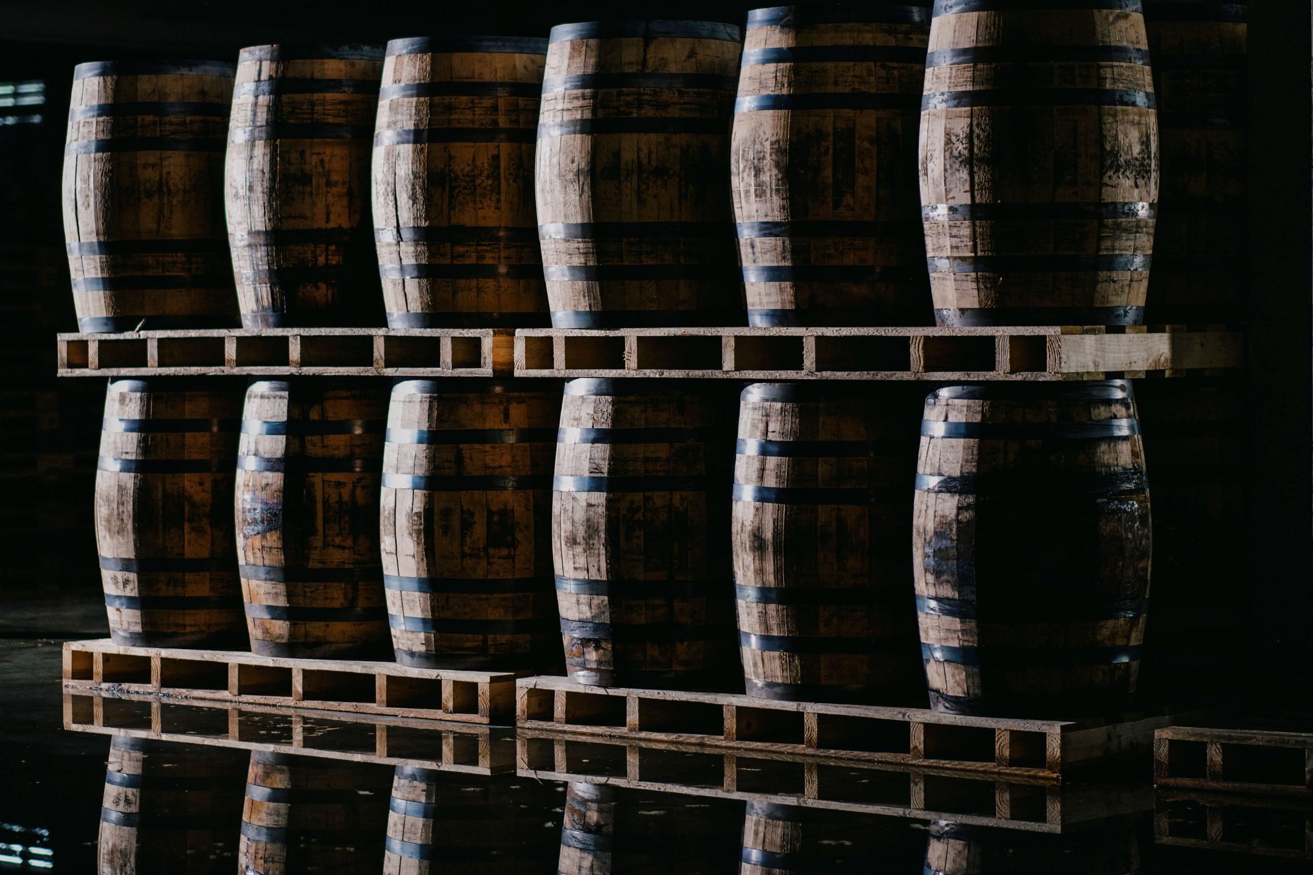 Stacked pallets of wooden casks